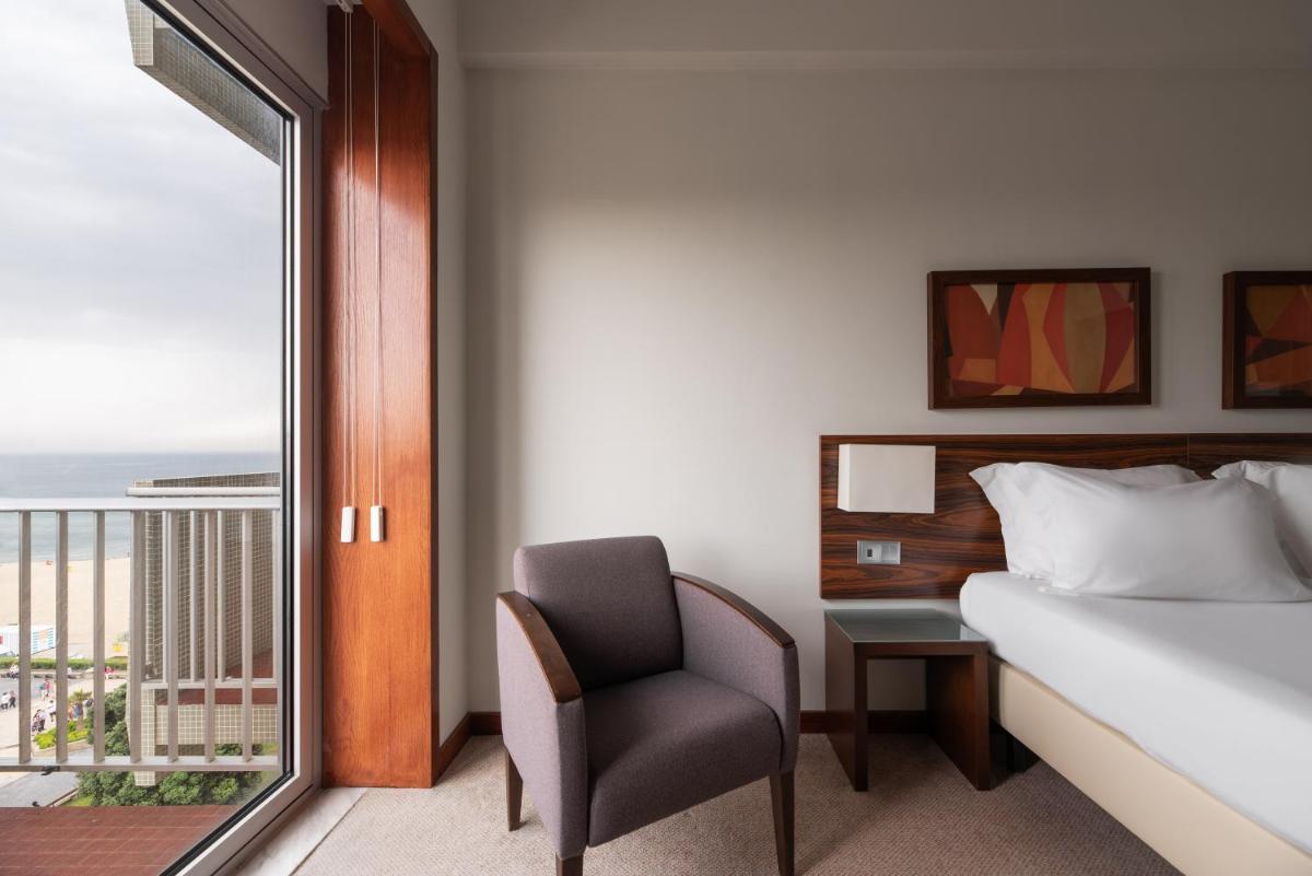 Uma cama ou camas num quarto em Dorma Praia Golfe