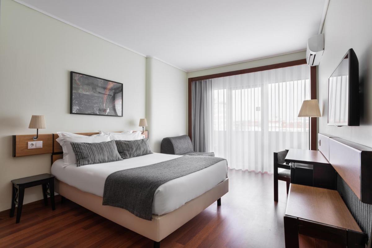 Uma cama ou camas num quarto em Dorma Praia Golfe