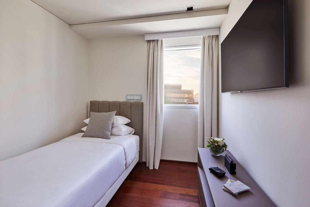 Cama o camas de una habitación en Hyatt Regency Madrid Residences