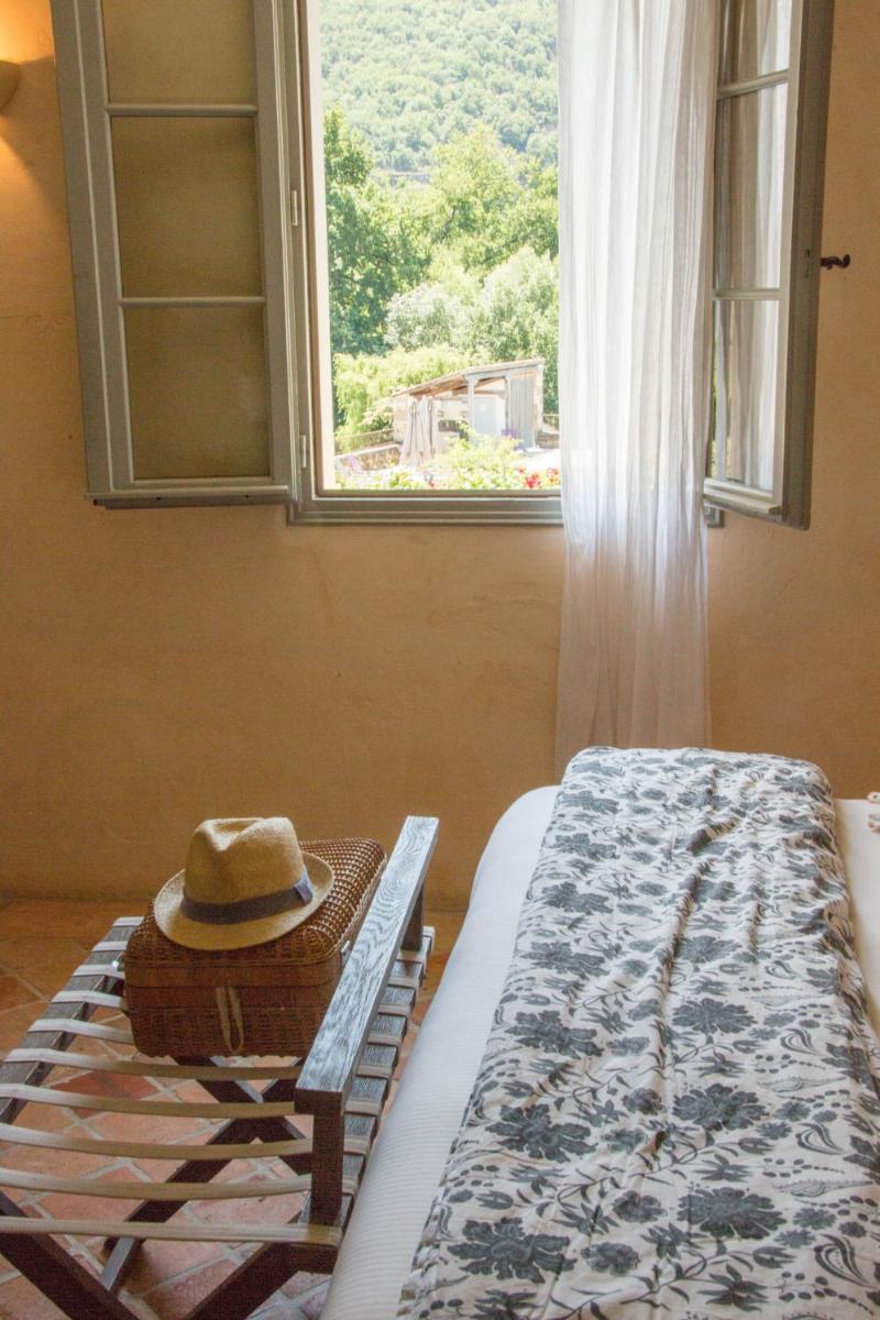 Un ou plusieurs lits dans un hébergement de l'établissement Hôtel-Spa Le Saint Cirq