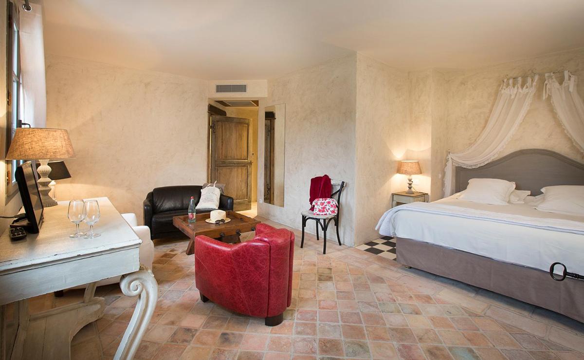 Un ou plusieurs lits dans un hébergement de l'établissement Hôtel-Spa Le Saint Cirq