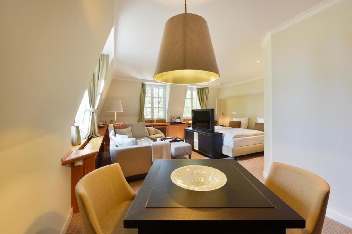 Ein Sitzbereich in der Unterkunft Hotel Landhaus Wachtelhof