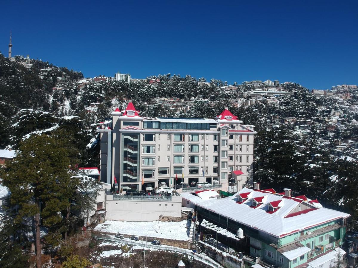 a large building with red roofs on top of it at WelcomHeritage Elysium Resort & Spa in Shimla