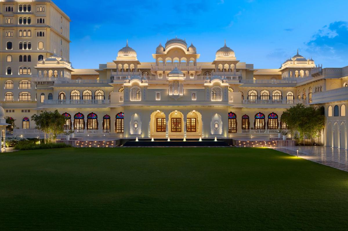 a large building with a large lawn in front of it at Hyatt Regency Jaipur Mansarovar in Jaipur a large building with a large lawn in front of it at Hyatt Regency Jaipur Mansarovar in Jaipur