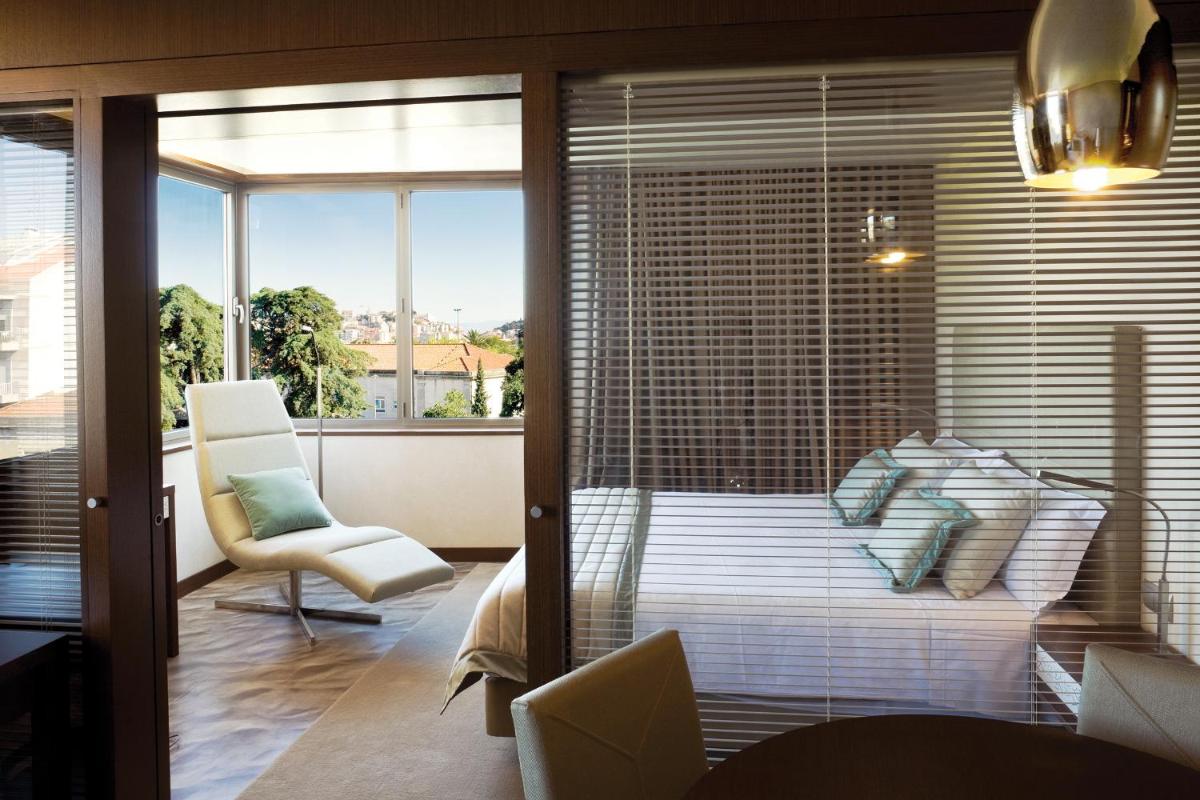 Uma cama ou camas num quarto em NEYA Lisboa Hotel