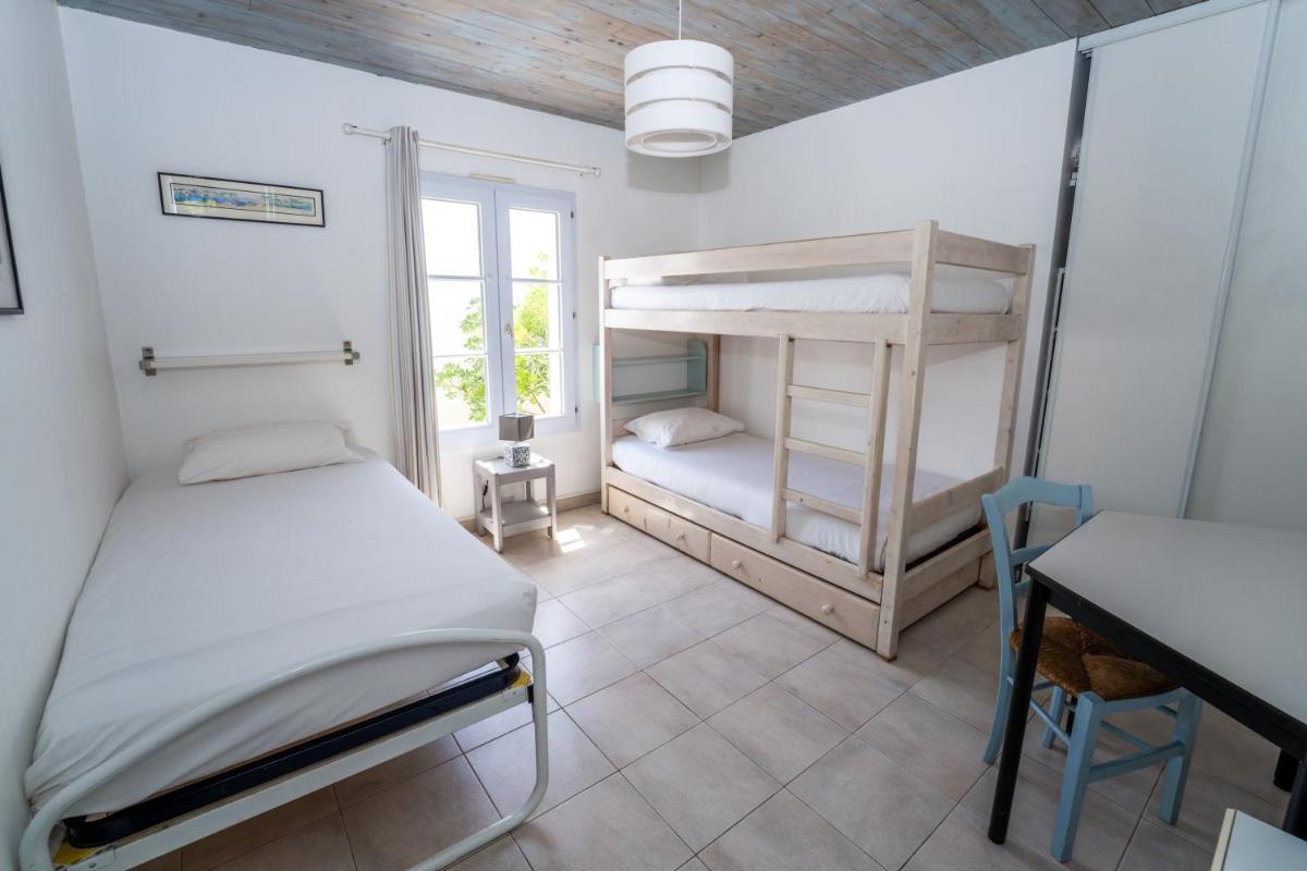 Un ou plusieurs lits dans un hébergement de l'établissement Hôtel Restaurant & Spa Plaisir