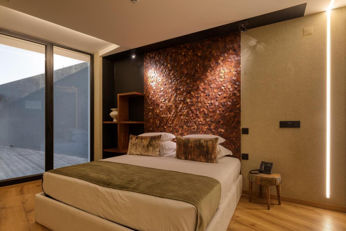 Uma cama ou camas num quarto em Well Hotel & Spa