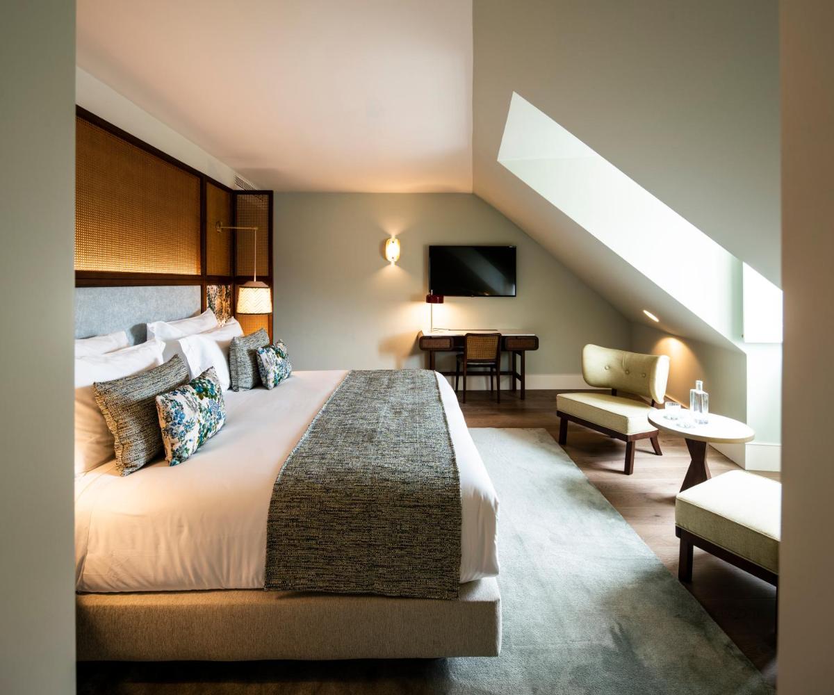 Uma cama ou camas num quarto em Palácio Ludovice Wine Experience Hotel