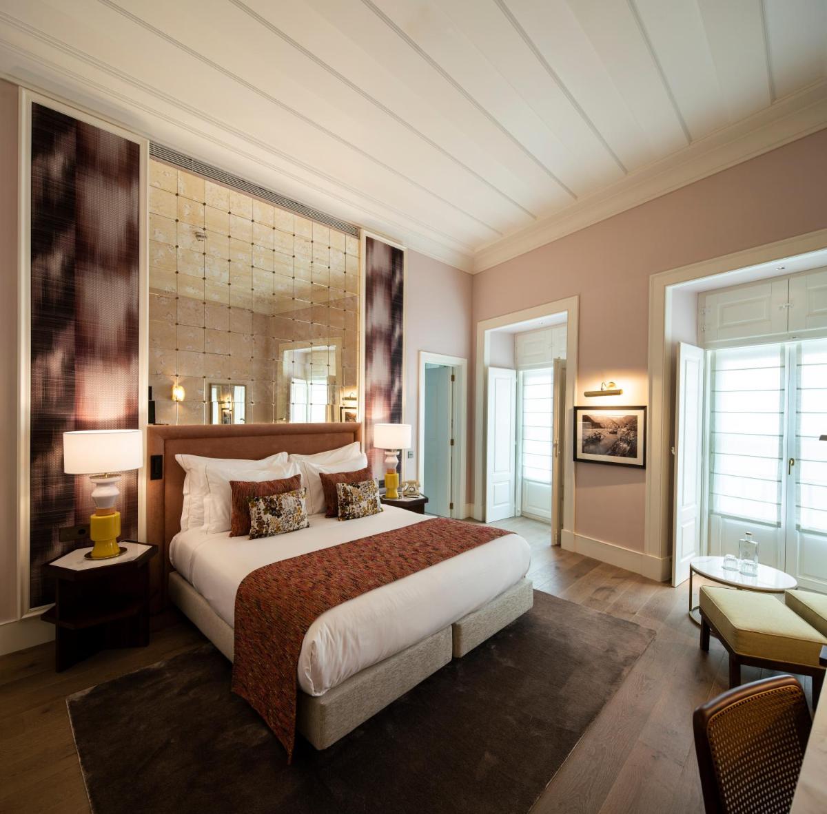 Uma cama ou camas num quarto em Palácio Ludovice Wine Experience Hotel