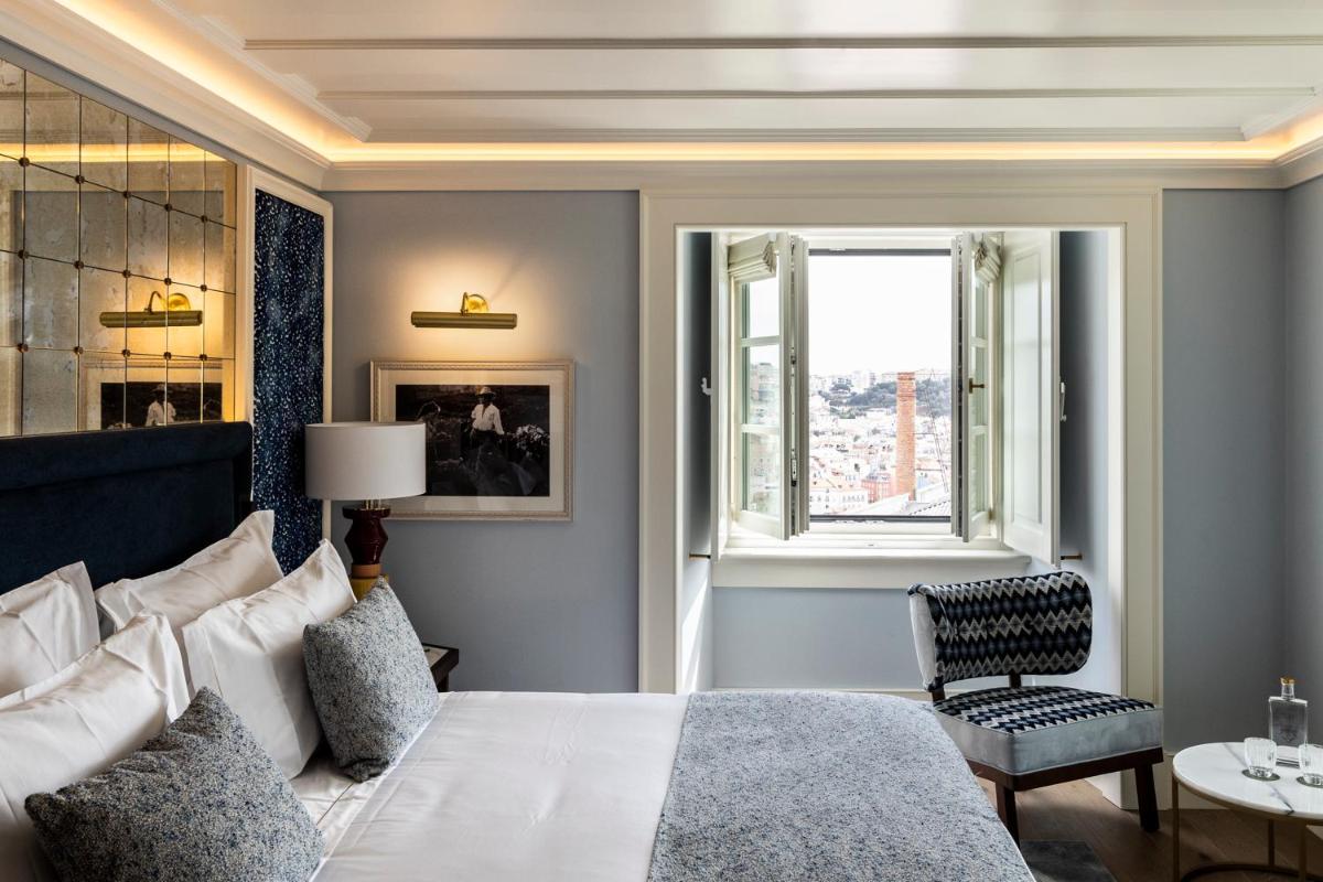 Uma cama ou camas num quarto em Palácio Ludovice Wine Experience Hotel