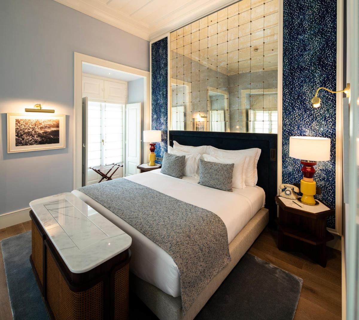 Uma cama ou camas num quarto em Palácio Ludovice Wine Experience Hotel