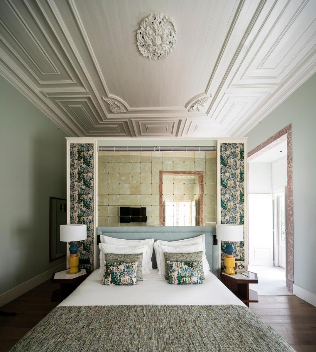 Uma cama ou camas num quarto em Palácio Ludovice Wine Experience Hotel