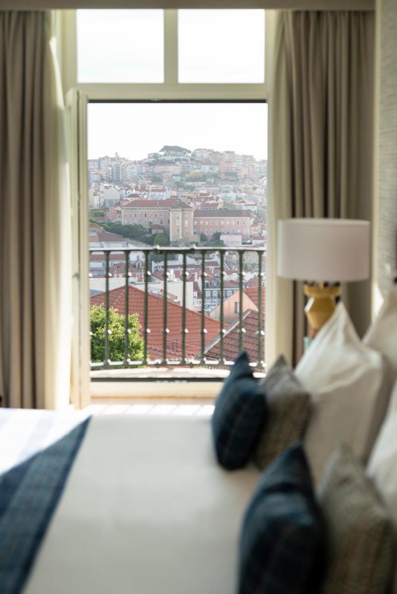 Uma cama ou camas num quarto em Palácio Ludovice Wine Experience Hotel