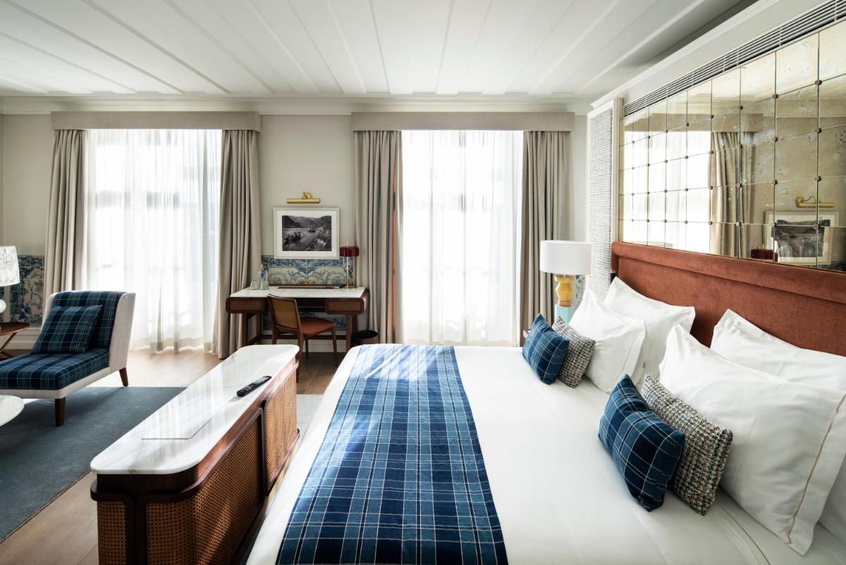Uma cama ou camas num quarto em Palácio Ludovice Wine Experience Hotel