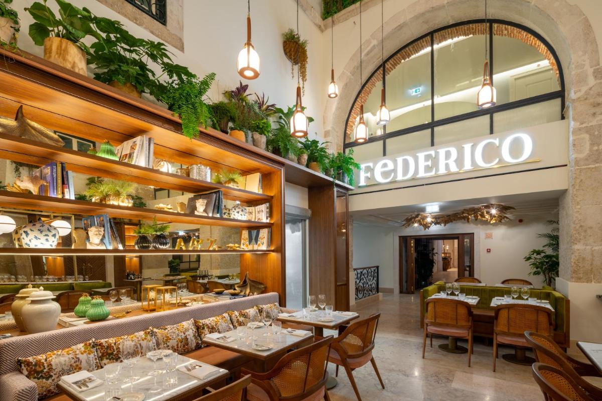 Um restaurante ou outro lugar para comer em Palácio Ludovice Wine Experience Hotel