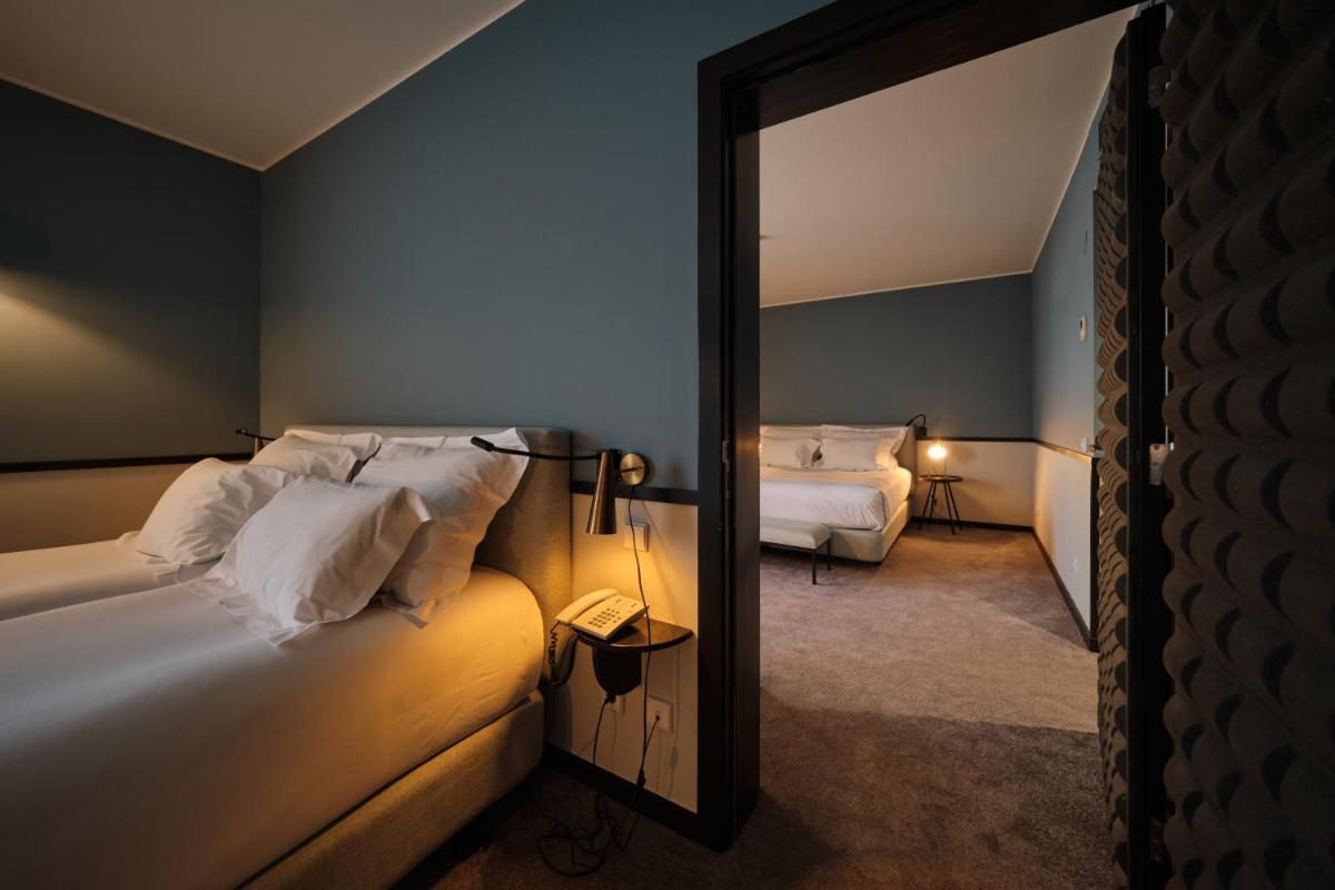 Uma cama ou camas num quarto em Octant Lousa