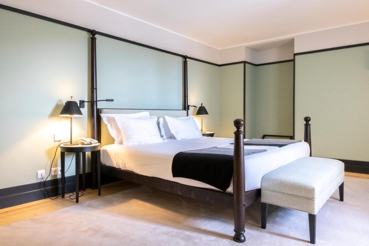Uma cama ou camas num quarto em Octant Lousa