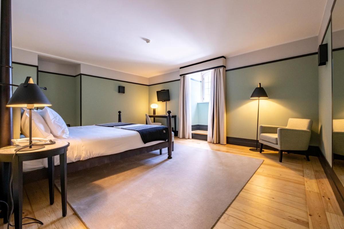 Uma cama ou camas num quarto em Octant Lousa