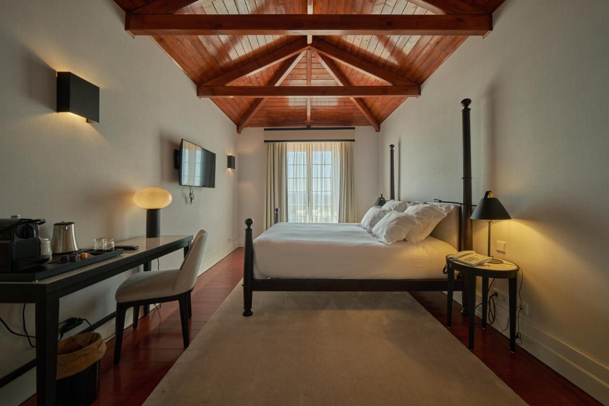 Uma cama ou camas num quarto em Octant Lousa