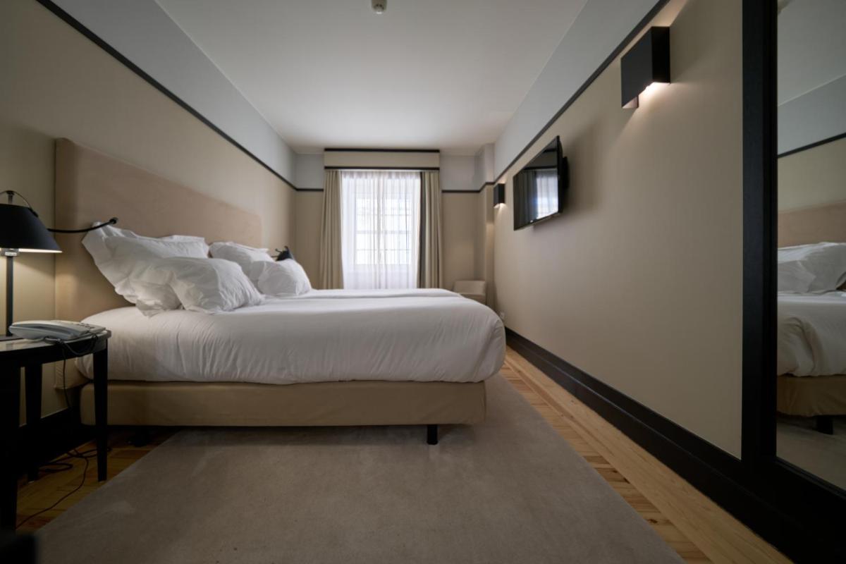 Uma cama ou camas num quarto em Octant Lousa