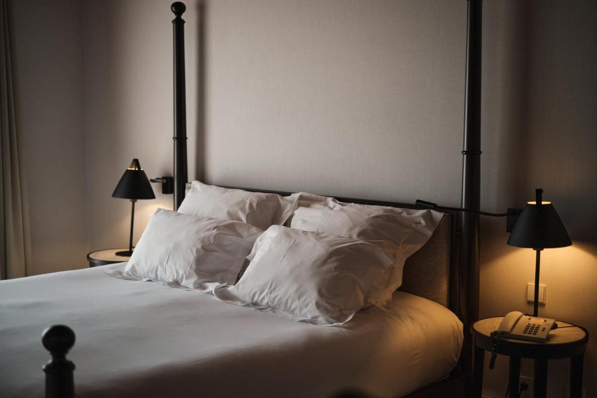 Uma cama ou camas num quarto em Octant Lousa