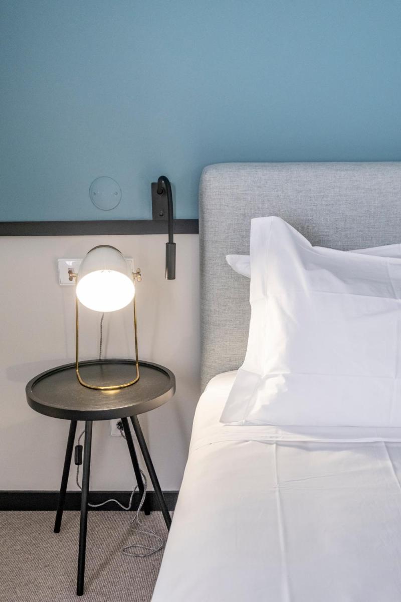 Uma cama ou camas num quarto em Octant Lousa