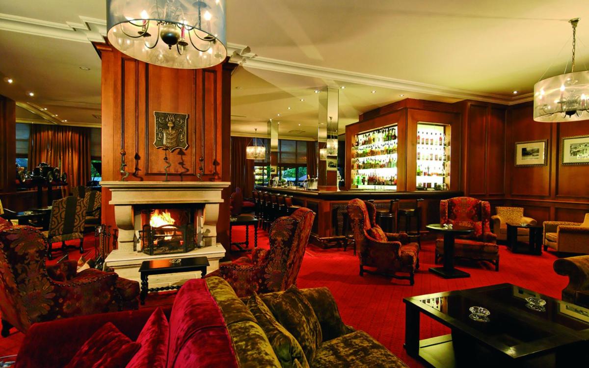 Coin salon dans l'établissement Le Grand Hotel & Spa