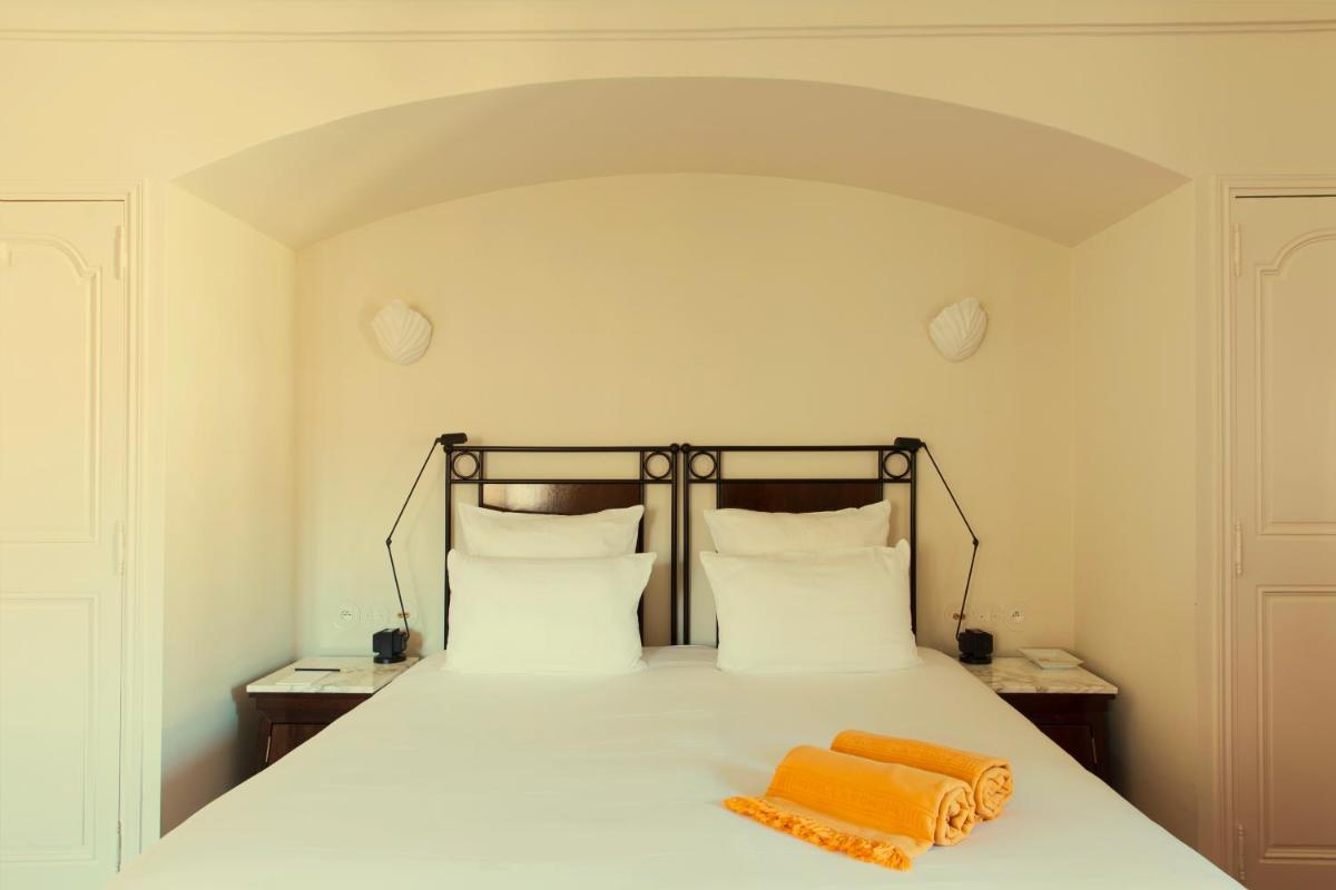 Un ou plusieurs lits dans un hébergement de l'établissement Hotel la Ponche