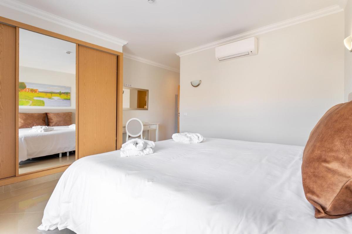 Uma cama ou camas num quarto em Boavista Golf & Spa - Bela Colina Holidays