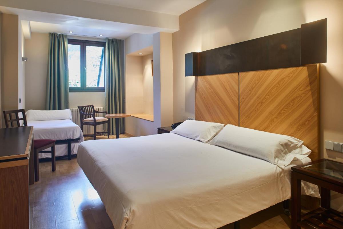 Cama o camas de una habitación en Silken Ordesa