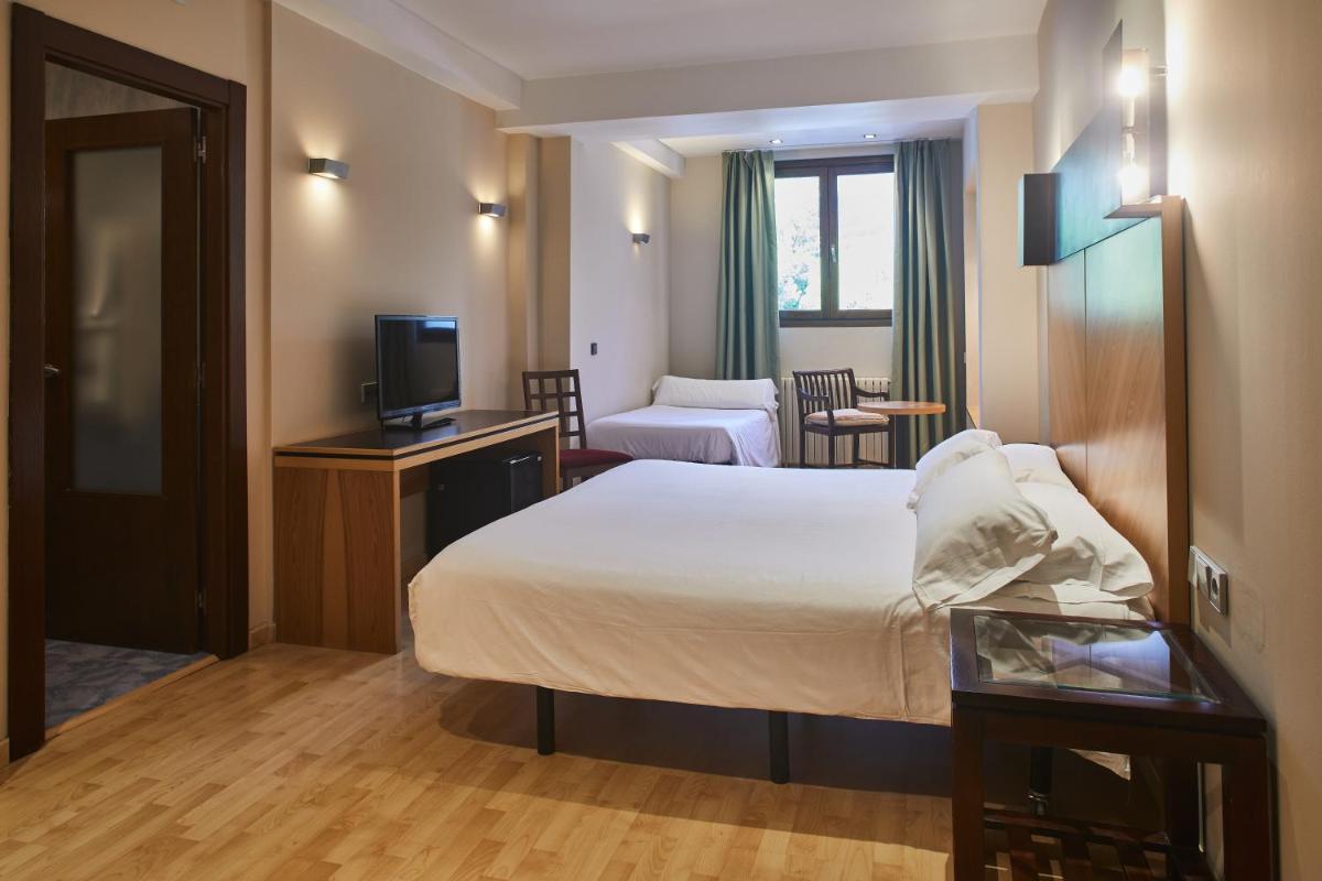 Cama o camas de una habitación en Silken Ordesa