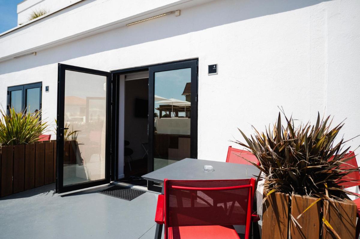 Balcon ou terrasse dans l'établissement Le Grand Hotel de la Plage