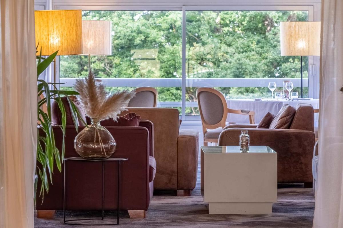 Coin salon dans l'établissement Domaine des Dryades