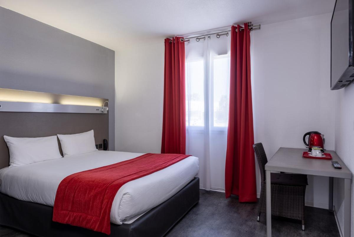 Un ou plusieurs lits dans un hébergement de l'établissement The Originals City, Hôtel Les Dômes, Perpignan Sud Saleilles