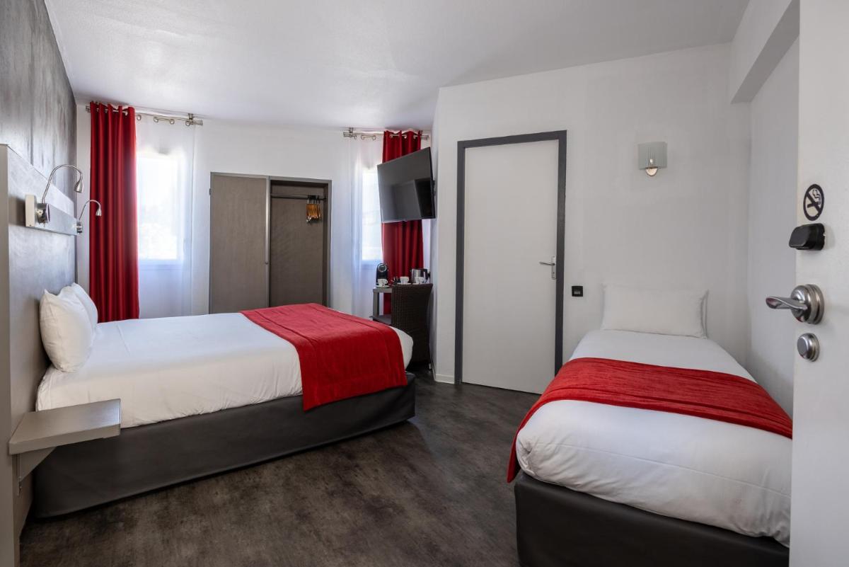 Un ou plusieurs lits dans un hébergement de l'établissement The Originals City, Hôtel Les Dômes, Perpignan Sud Saleilles