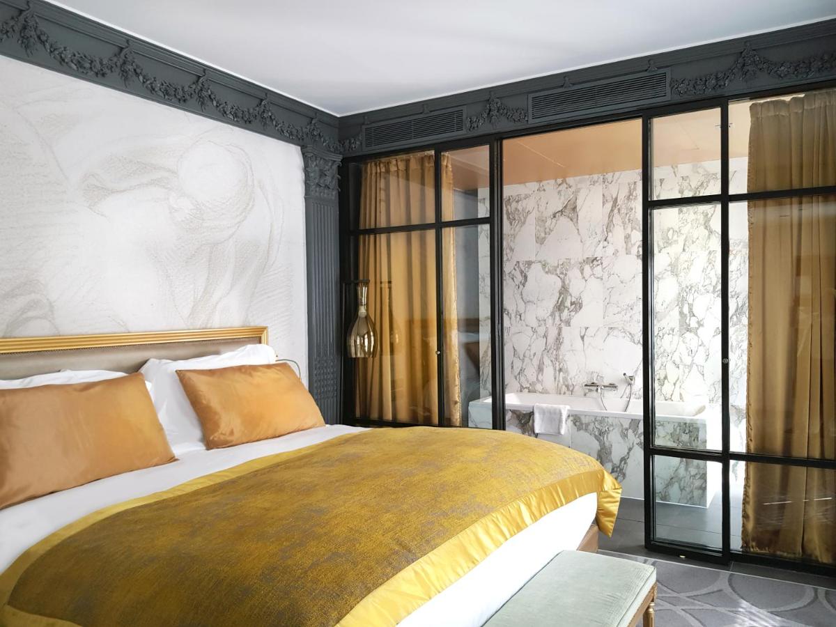 Un ou plusieurs lits dans un hébergement de l'établissement Sofitel Paris Le Faubourg