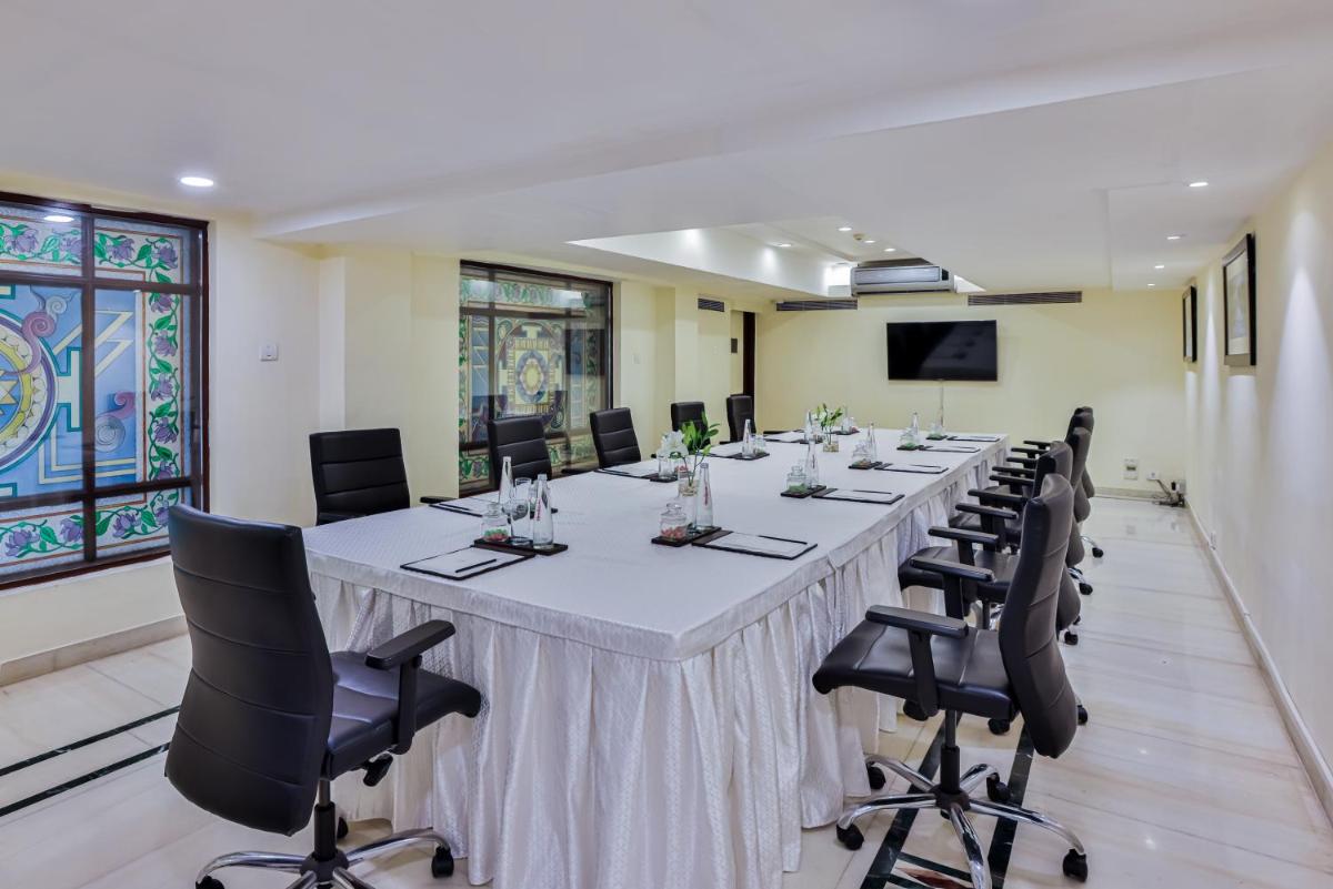a large conference room with a long table and chairs at Taj Ganges Varanasi in Varanasi