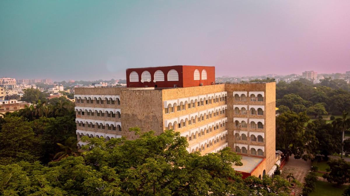 a building with a clock tower on top of it at Taj Ganges Varanasi in Varanasi
