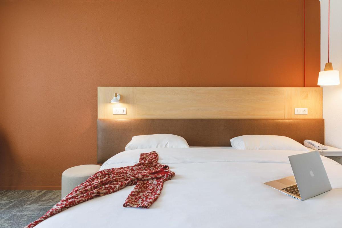 Un ou plusieurs lits dans un hébergement de l'établissement ibis Styles Aix les Bains Domaine de Marlioz