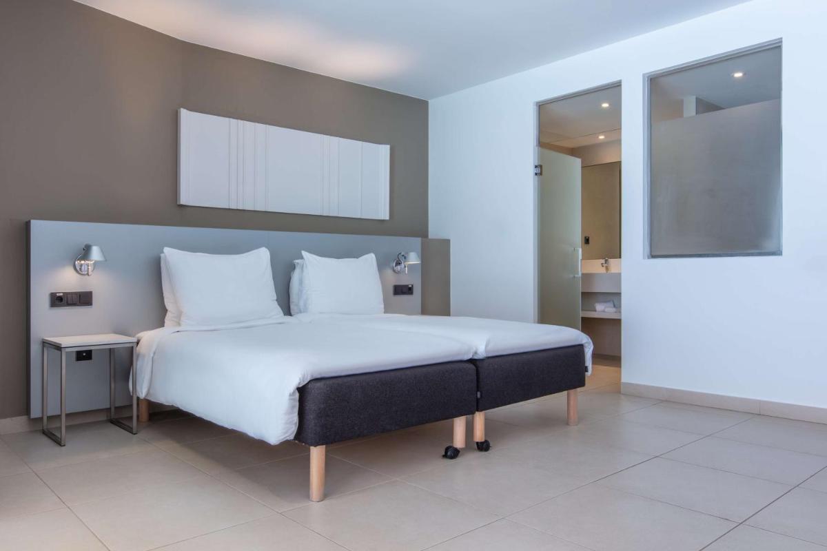 Cama o camas de una habitación en Radisson Blu Resort & Spa, Gran Canaria Mogan