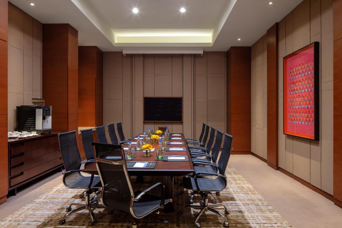 a conference room with a long table and chairs at Hyatt Regency Chandigarh in Chandīgarh