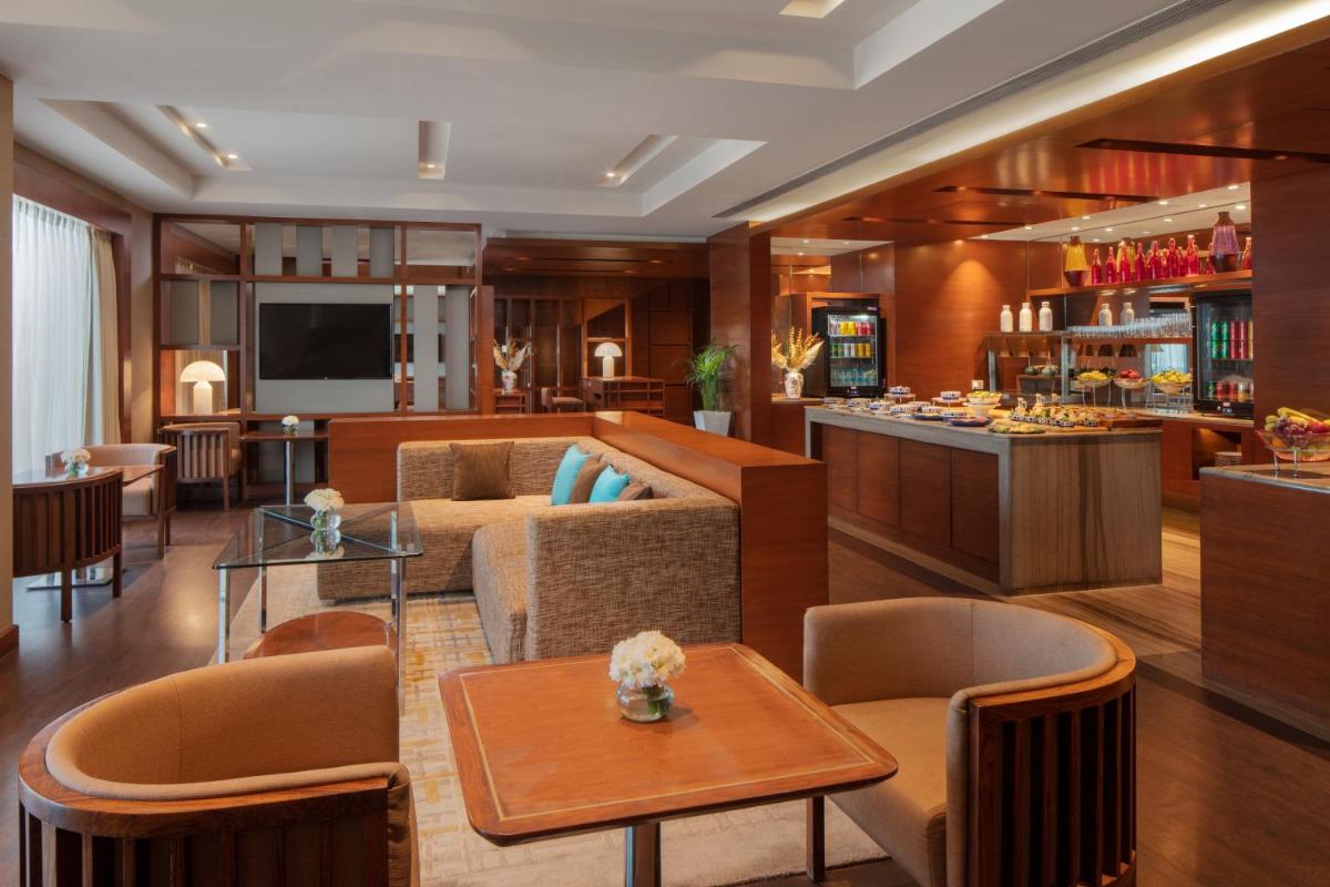 a living room with a couch and a table at Hyatt Regency Chandigarh in Chandīgarh