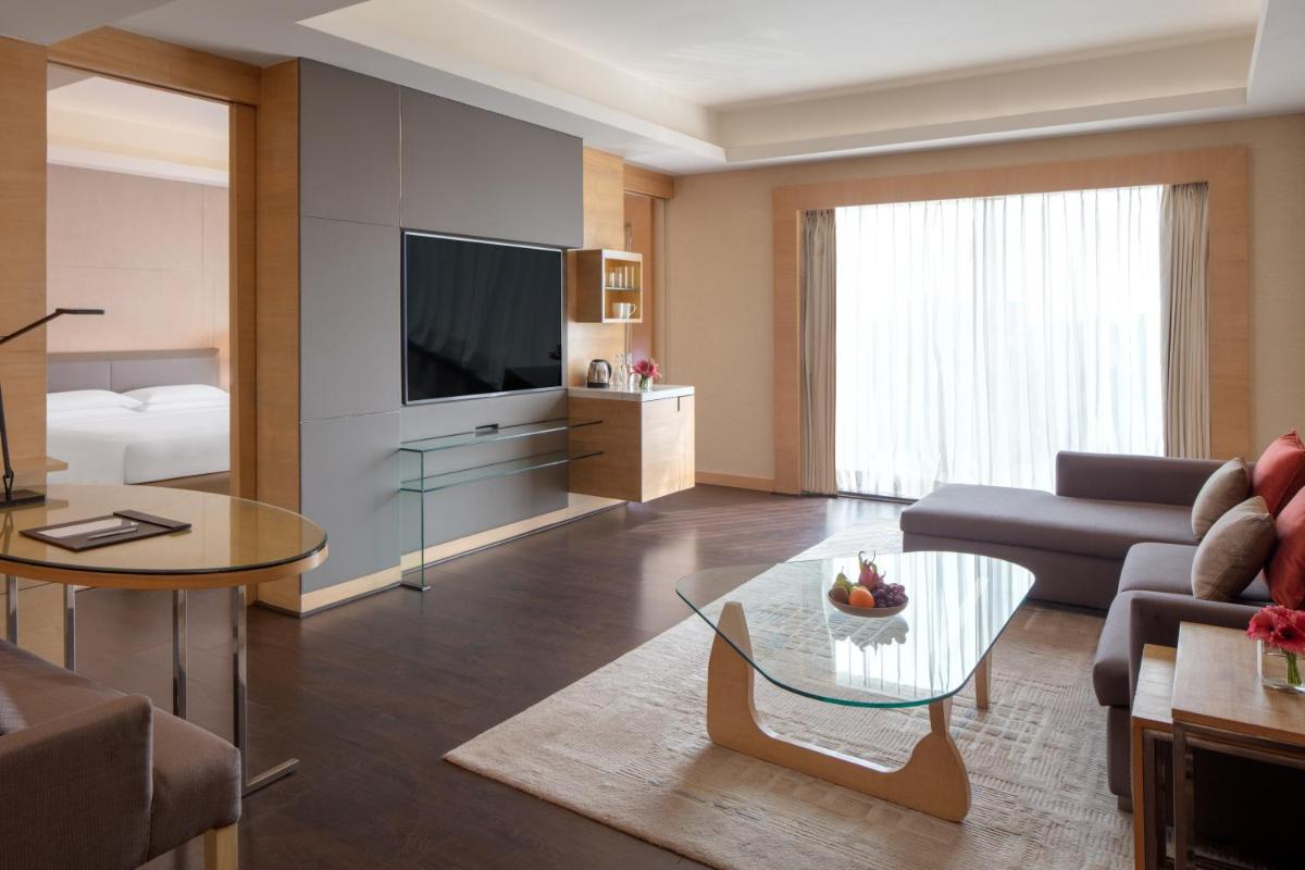 a living room with a couch and a table at Hyatt Regency Chandigarh in Chandīgarh