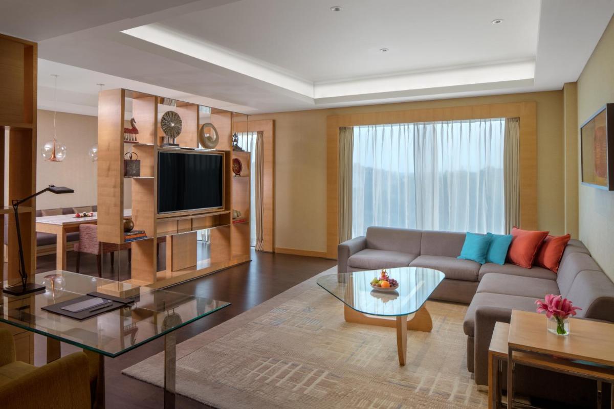 a living room with a couch and a table at Hyatt Regency Chandigarh in Chandīgarh