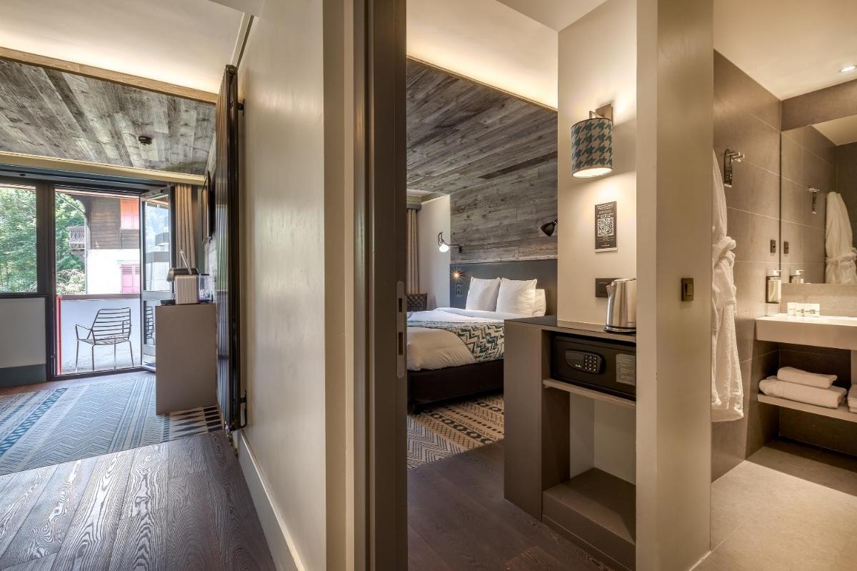 Un ou plusieurs lits dans un hébergement de l'établissement Chalet Hôtel Le Prieuré & Spa