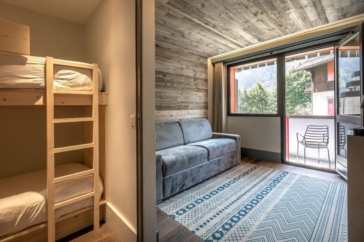 Un ou plusieurs lits dans un hébergement de l'établissement Chalet Hôtel Le Prieuré & Spa