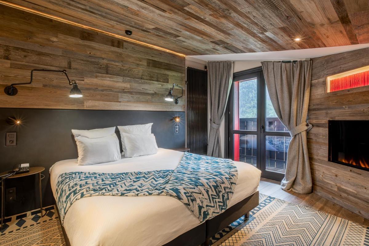 Un ou plusieurs lits dans un hébergement de l'établissement Chalet Hôtel Le Prieuré & Spa