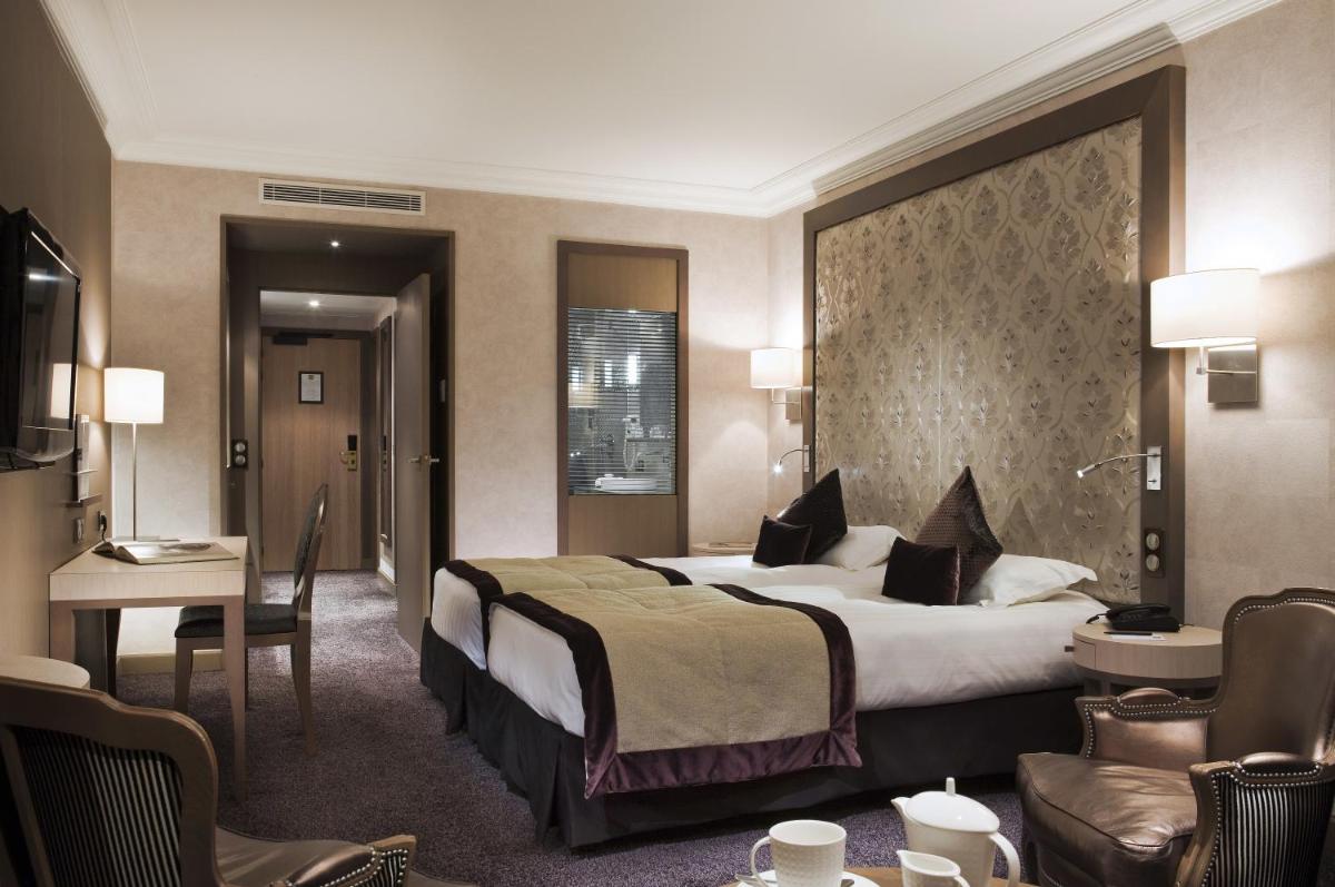 Un ou plusieurs lits dans un hébergement de l'établissement Grand Hôtel Des Thermes