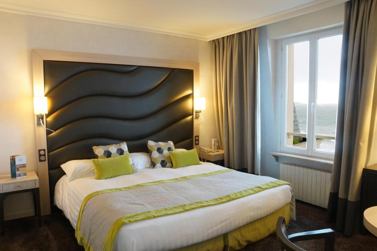 Un ou plusieurs lits dans un hébergement de l'établissement Grand Hôtel Des Thermes