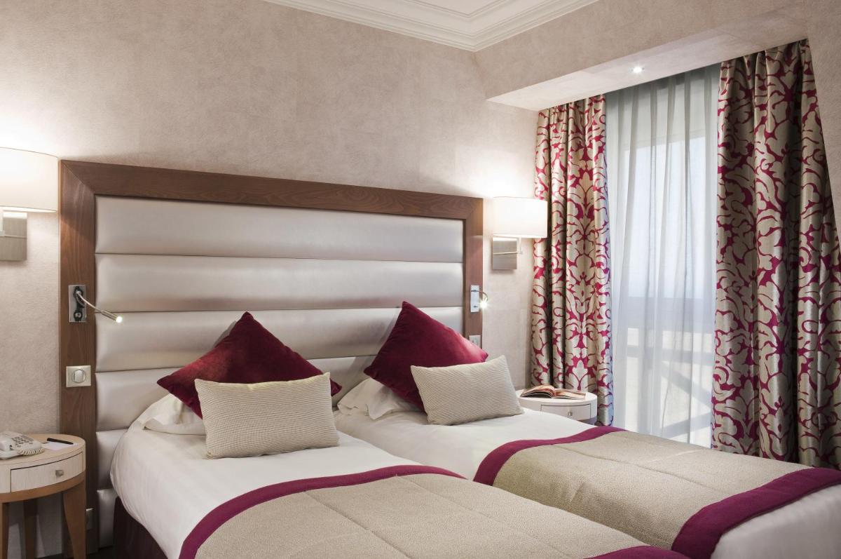 Un ou plusieurs lits dans un hébergement de l'établissement Grand Hôtel Des Thermes